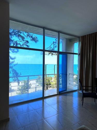 a living room with a view of the ocean at Hotel Solidarity in K'obulet'i