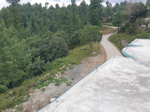 a view of a road with a water park at Mashal Palace Apartment's in Nathia Gali