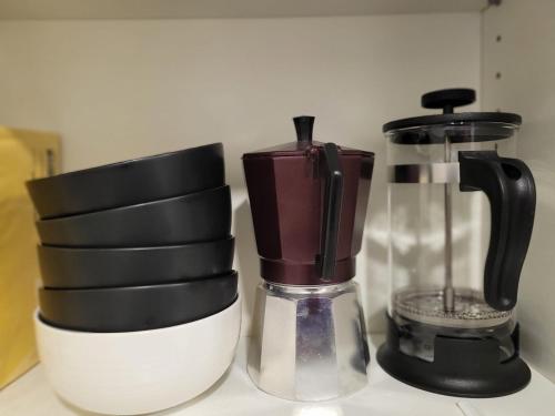 a black and white blender sitting on top of a counter at Großzügiges Appartement in der Festspielstadt in Bad Hersfeld