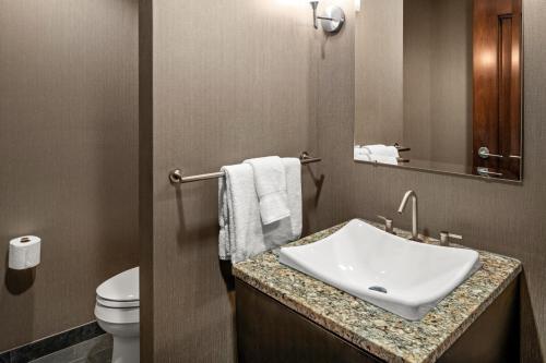 a bathroom with a sink and a toilet at Mount Airy Casino Resort - Adults Only 21 Plus in Mount Pocono
