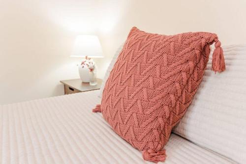 a pillow sitting on top of a bed at Kinston Getaway #2 in Kinston