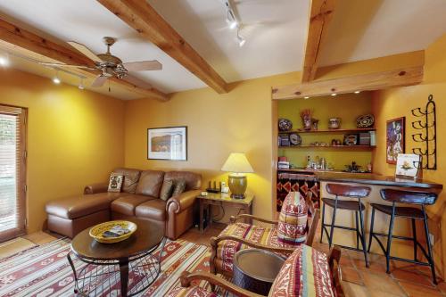 a living room with a couch and a table at Susan's Hideaway Unit B in Santa Fe
