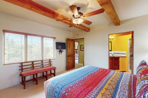 a bedroom with a bed and a ceiling fan at Susan's Hideaway Unit B in Santa Fe