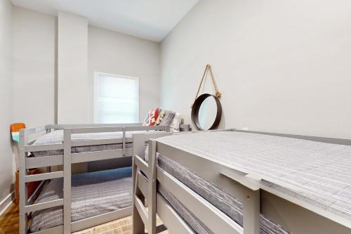 a bedroom with a bed and a mirror at Coastal Escape in Pawleys Island