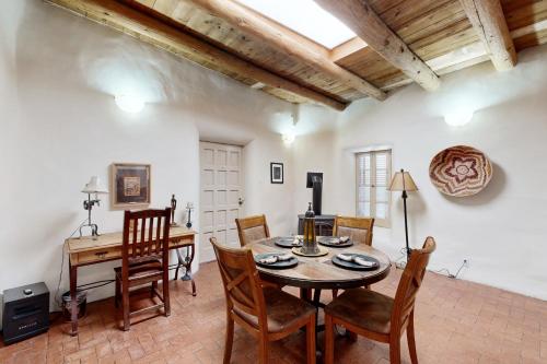 a dining room with a table and chairs at Reposada Unit 1 in Santa Fe