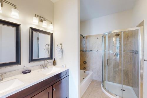 a bathroom with a sink and a shower at Shalako Adventures in Santa Fe