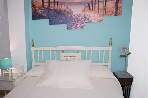 A bed or beds in a room at Apartamento San Juan de Dios