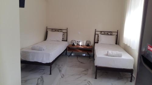 Postel nebo postele na pokoji v ubytování PHILIPPOS Hotel Apartments