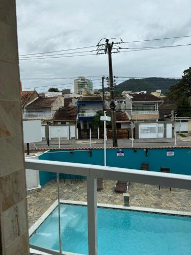 a view of a swimming pool from a balcony at Pousada Fast Inn in Guarujá