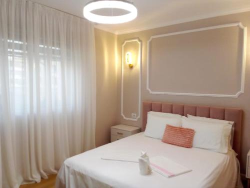 Postel nebo postele na pokoji v ubytování Vilma Apartment