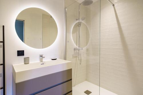 a bathroom with a sink and a shower at Bordazaharria in Espelette