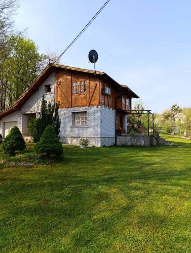 a house with a water tower on top of it at Villa Ema in Sarajevo
