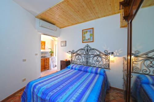 Ένα ή περισσότερα κρεβάτια σε δωμάτιο στο Casa Mare