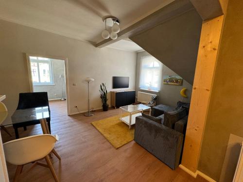 a living room with a couch and a table at Altstadtquartier Hagenstraße in Bad Freienwalde