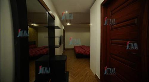 Кровать или кровати в номере One Bedroom Apartment Bahria Town Lahore