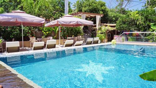 a swimming pool with a star in the water at Galazio Asteri 1 Green, Luxury & Eco in Loutrópolis Thermís