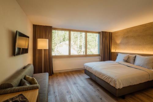 Postel nebo postele na pokoji v ubytování Säntis - das Hotel