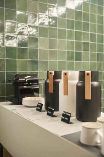 a counter in a bathroom with toilets on it at Bromelia Hotel Boutique in Buenos Aires