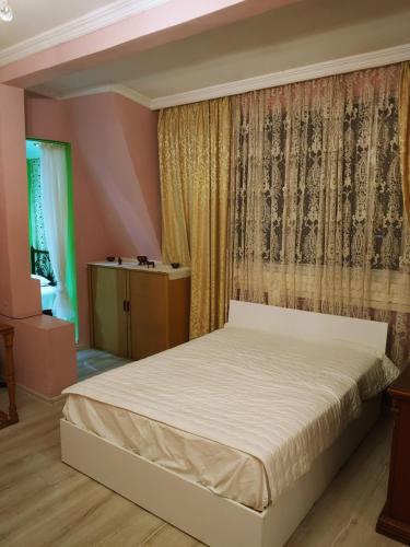 Ένα ή περισσότερα κρεβάτια σε δωμάτιο στο Apartment on Melashvili 24 (Old Batumi)