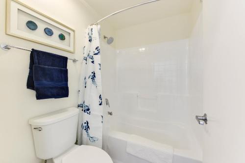 a bathroom with a white toilet and a shower at Wake Up on the Waters Edge in Los Angeles