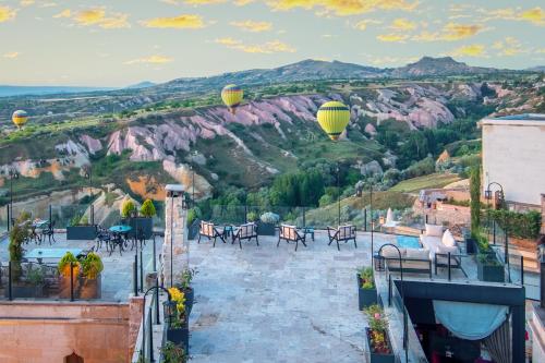 a view from the roof of a building with tables and chairs at Vigor Cappadocia - Special Class in Uchisar