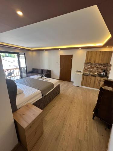 a bedroom with a large bed in a room at City Heart Apartments in Ulcinj