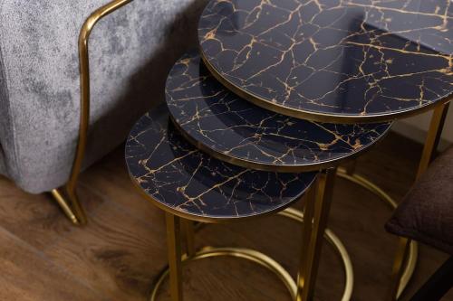 two blue and gold stools next to a couch at Luxueux et unique - Bobigny - Paris in Bobigny