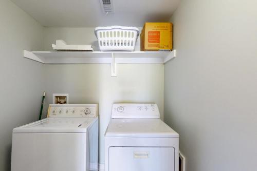 a small laundry room with a washer and dryer at Paradise Pointe in Bumpass