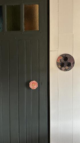 a door with two stickers on the side of it at AU LIT ON DORT - Logis de Village in Bellême