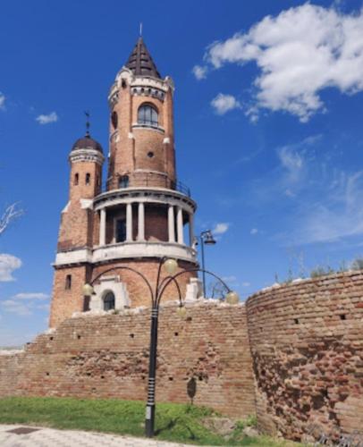 a tall tower on top of a brick wall at Magistar in Zemun