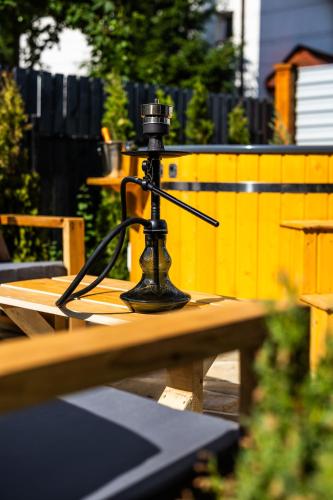 a camera on top of a wooden table at The Bear Chalet with Private Hot Tub in Buşteni