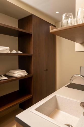a bathroom with a sink and a counter top at RiZEΣ in Ouranoupoli