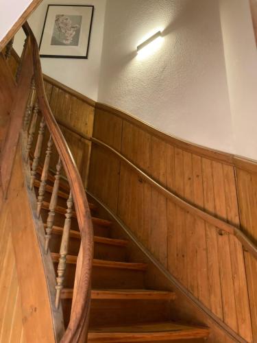 a spiral staircase in a house with wooden floors at Schelfblick in Schwerin