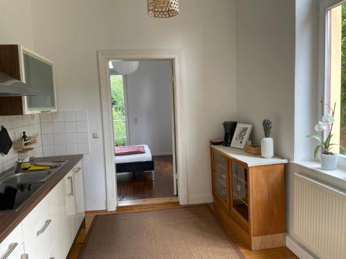 a kitchen with a sink and a counter top at Schelfblick in Schwerin