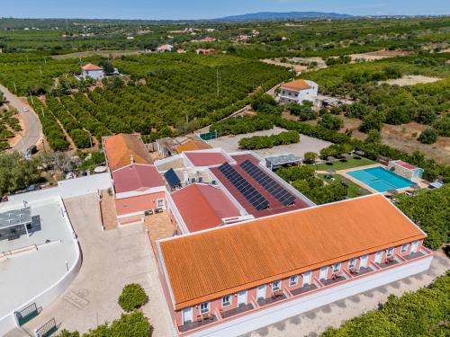 an overhead view of a house with an orange roof at Quinta dos Is in Algoz
