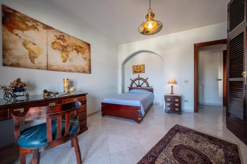 a bedroom with a bed and a desk and a desk sidx sidx sidx at Dolfi Grand Loft in Iglesias