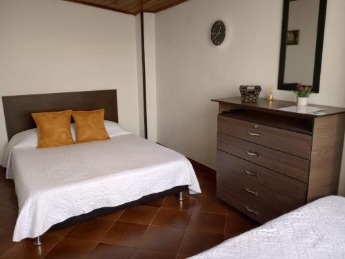 Postel nebo postele na pokoji v ubytování Habitaciones C&S Bogotá
