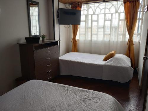 Postel nebo postele na pokoji v ubytování Habitaciones C&S Bogotá