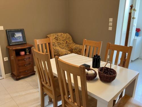 a dining room with a table and chairs and a television at Rooms 22 - Beachfront in Primošten
