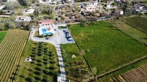 an aerial view of a parking lot in a field at Rev'ôthijol Vacances in Saint Alban Auriolles