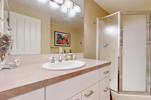 a bathroom with a sink and a shower at Firepit Lagoon in Oceanside