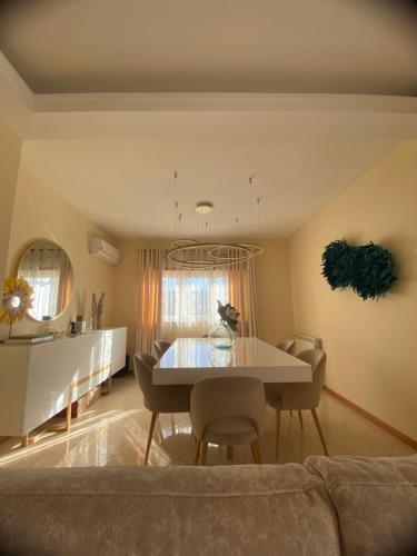 a living room with a table and chairs and a couch at Casa7pias in Ponte de Lima