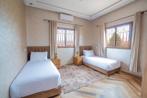 Ένα ή περισσότερα κρεβάτια σε δωμάτιο στο Blumen Villa