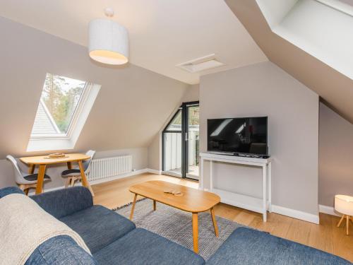 TV a/nebo společenská místnost v ubytování Osprey Apartment