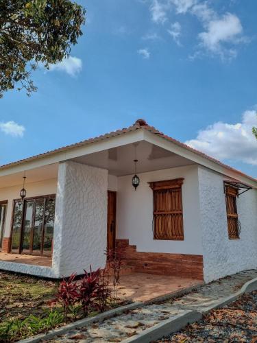 a rendering of a small house at Tumbaga Hostal in Quimbaya