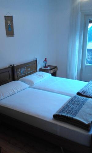 En eller flere senge i et værelse på Appartamento Prof. Carlo Pais