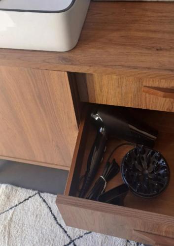 a kitchen utensils in a drawer of a cabinet at Mini appartamento a Monza in Monza