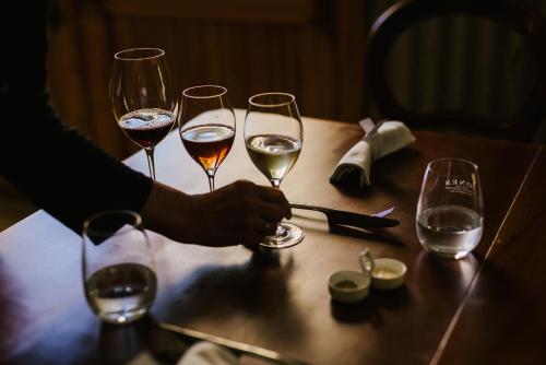 a group of wine glasses sitting on a table at Jones Winery Tiny House on the Vineyard, Rutherglen - Off Grid in Rutherglen