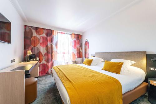 Ένα ή περισσότερα κρεβάτια σε δωμάτιο στο Best Western Premier Le Masq Hotel