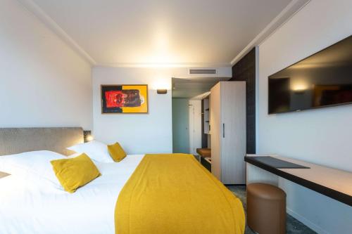Ένα ή περισσότερα κρεβάτια σε δωμάτιο στο Best Western Premier Le Masq Hotel